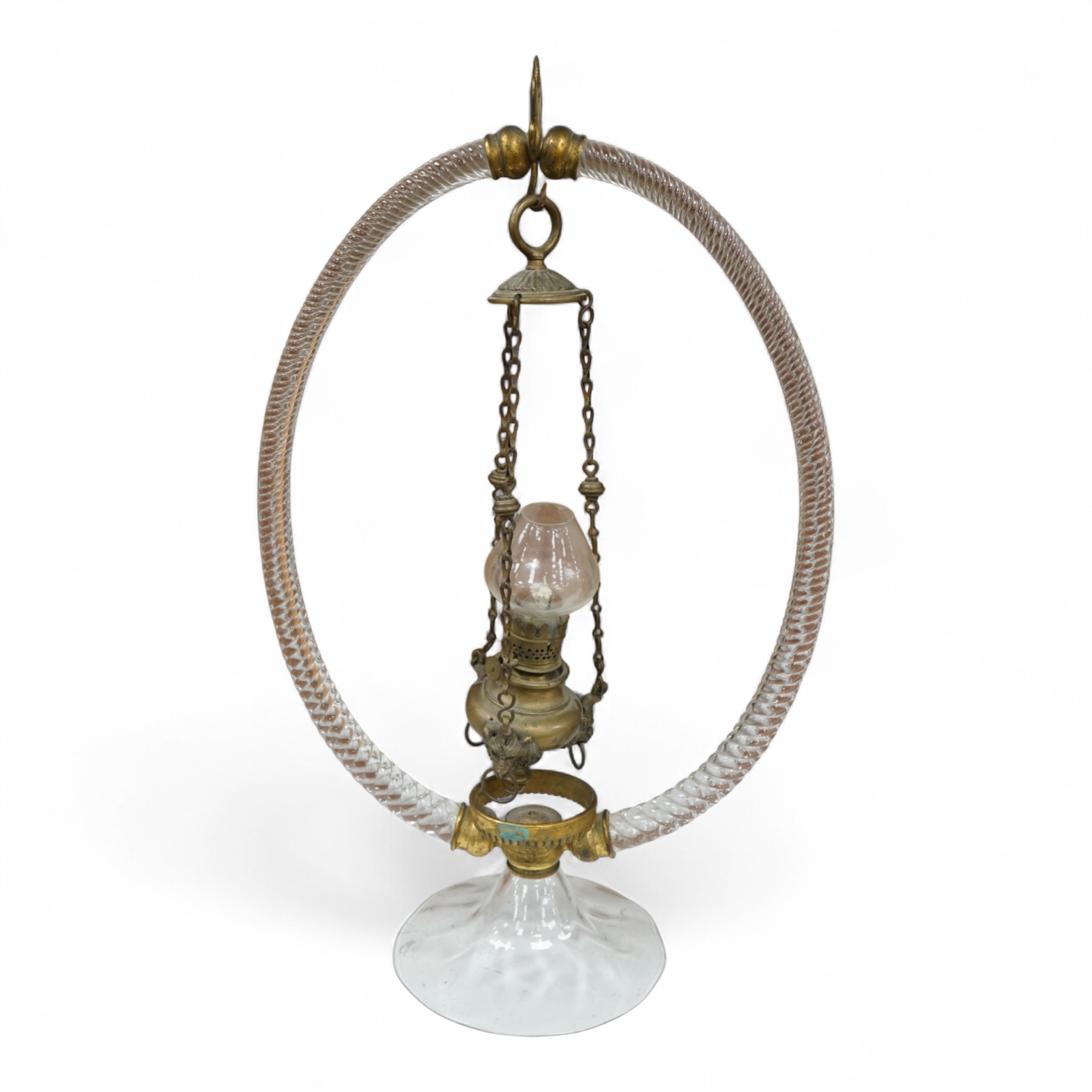 A Victorian glass frame with a central brass hanging oil lamp. 48cm high